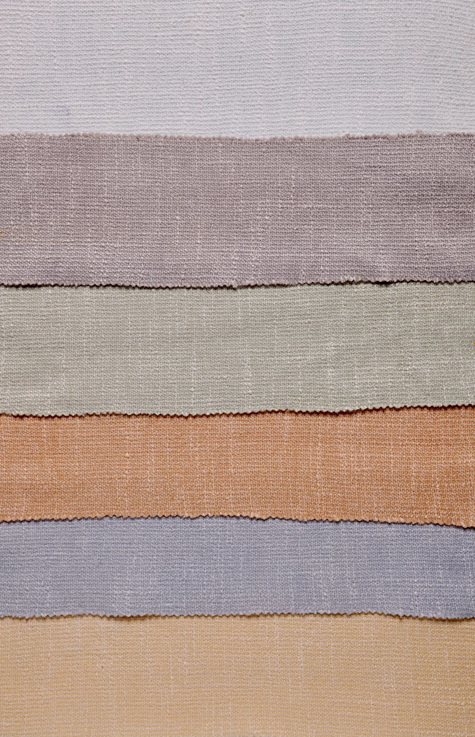 Luxury interior fabric samples showcasing 2025 trends in textures and earth tones