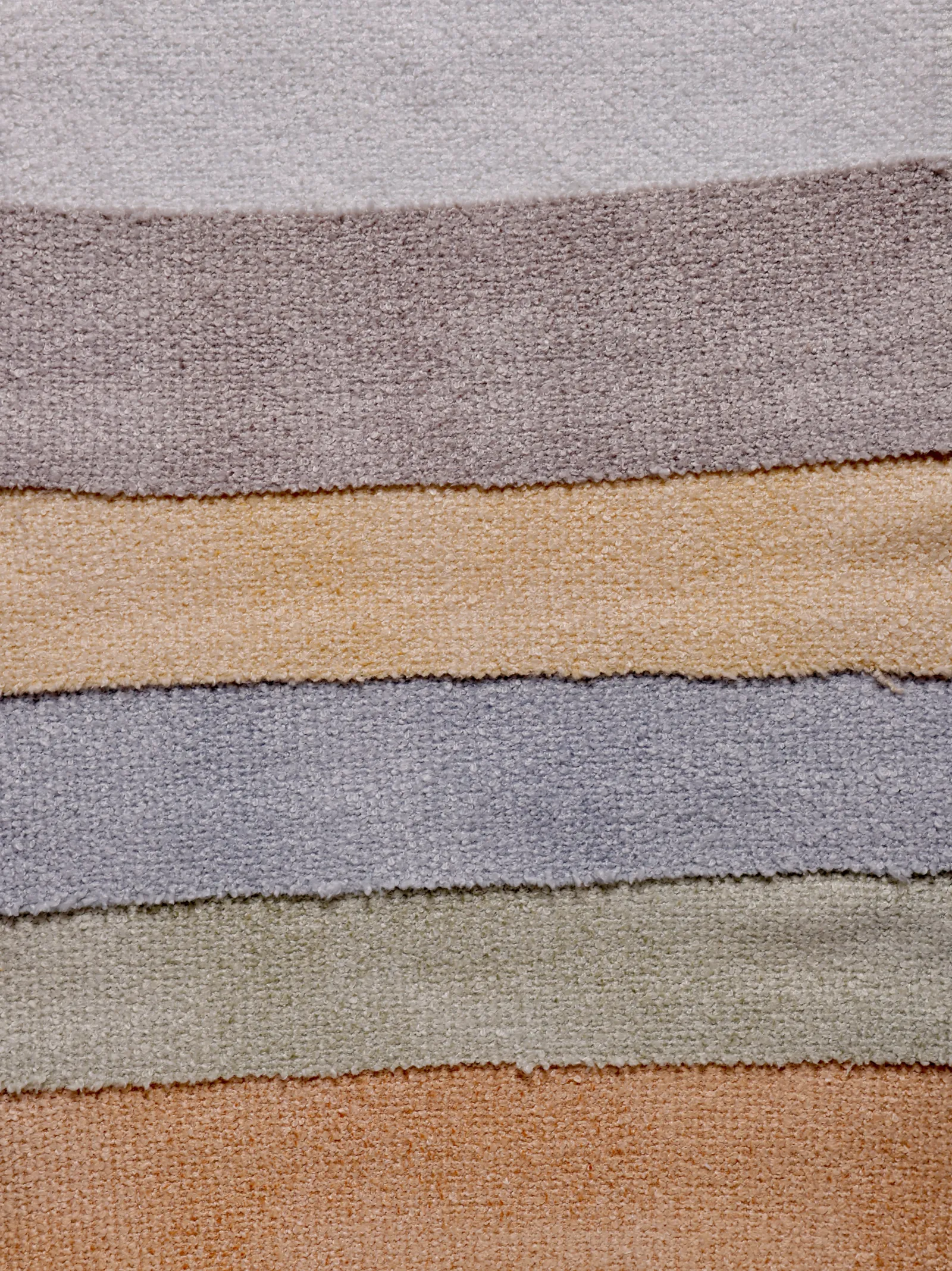 Various yarn compositions including polyester, cotton, and blended yarns displayed for comparison