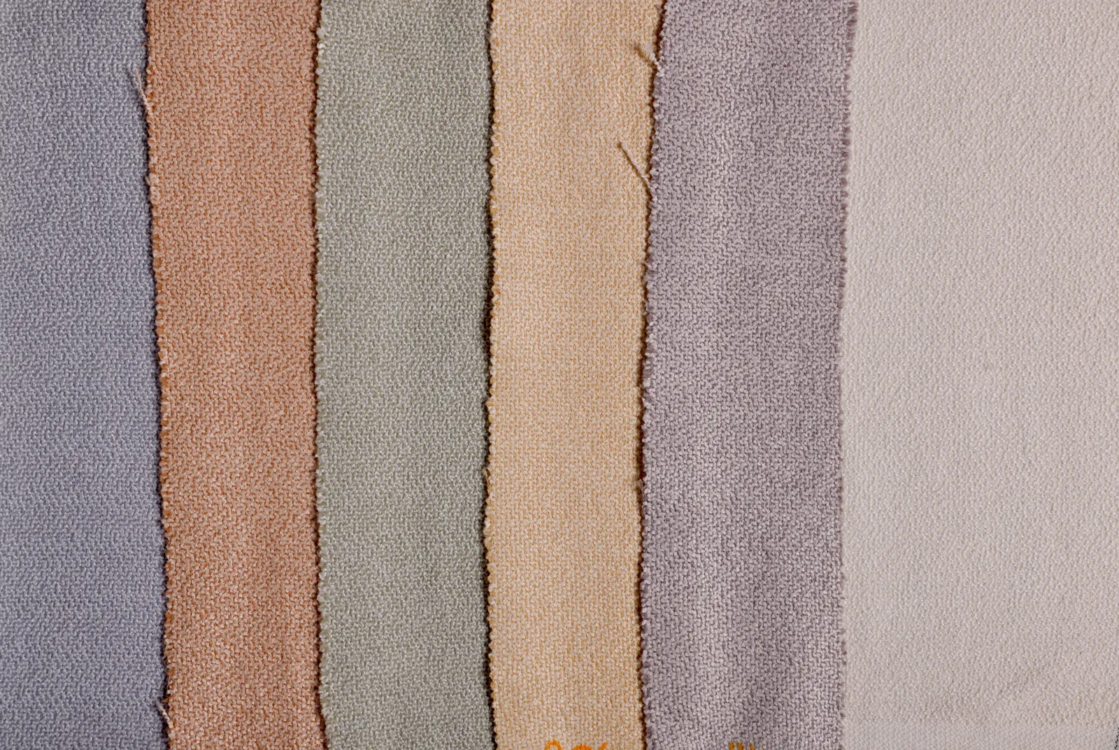 Different curtain fabrics showing varying yarn denier weights from sheer to blackout